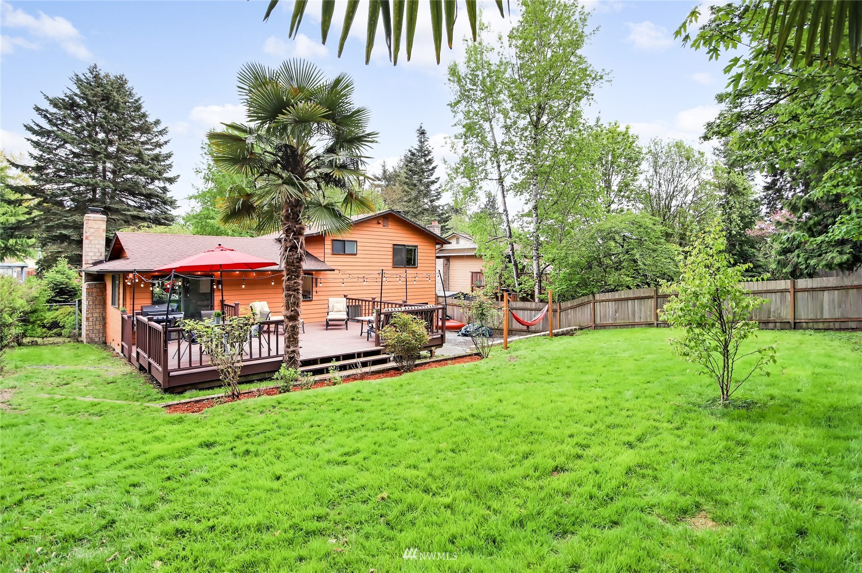 17818 Brook Boulevard Bothell, WA 98012 - Photo 21 of 27 a view of a house with backyard and a tree