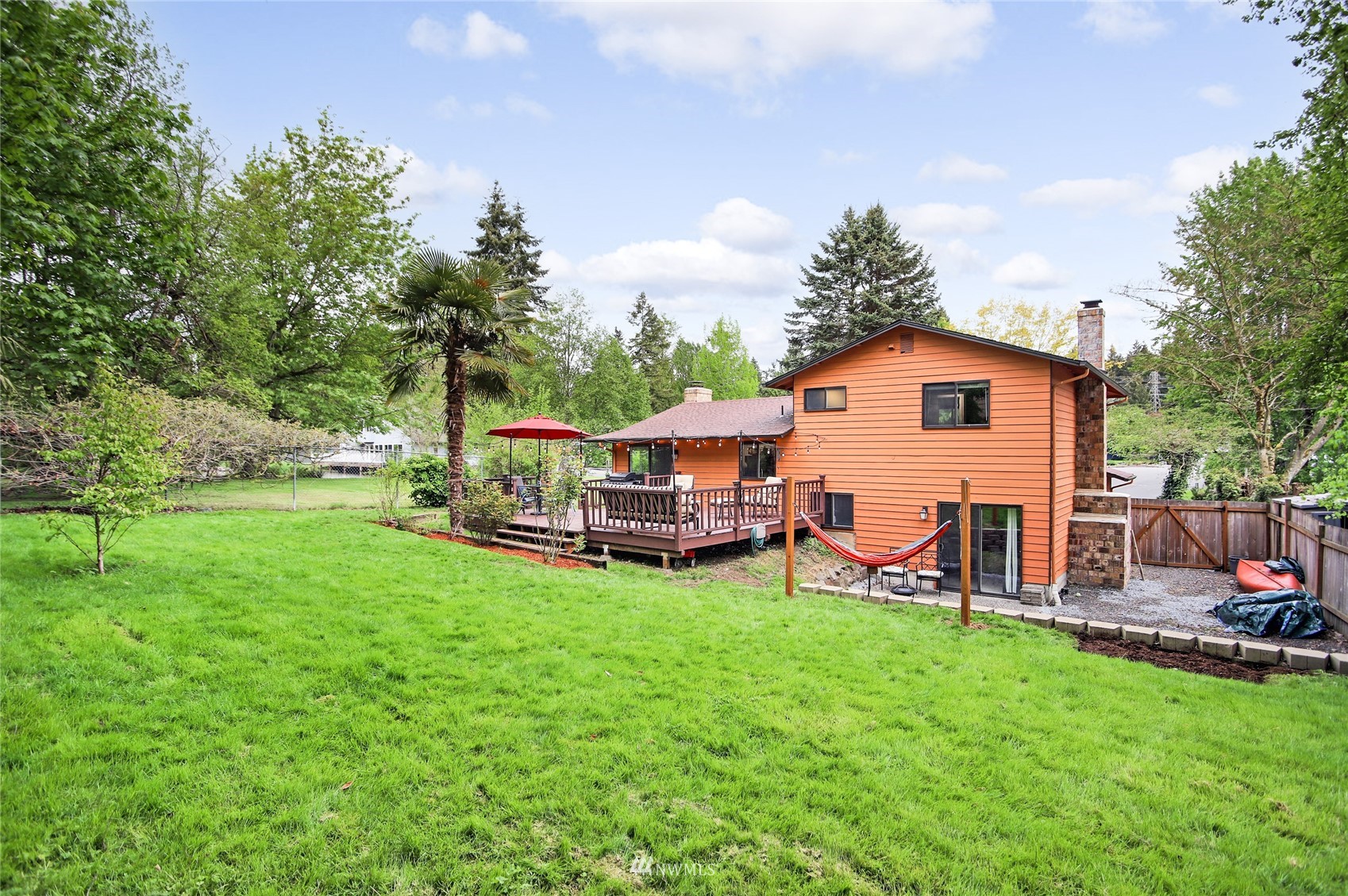 17818 Brook Boulevard Bothell, WA 98012 - Photo 22 of 27 a view of a house with a yard porch and sitting area