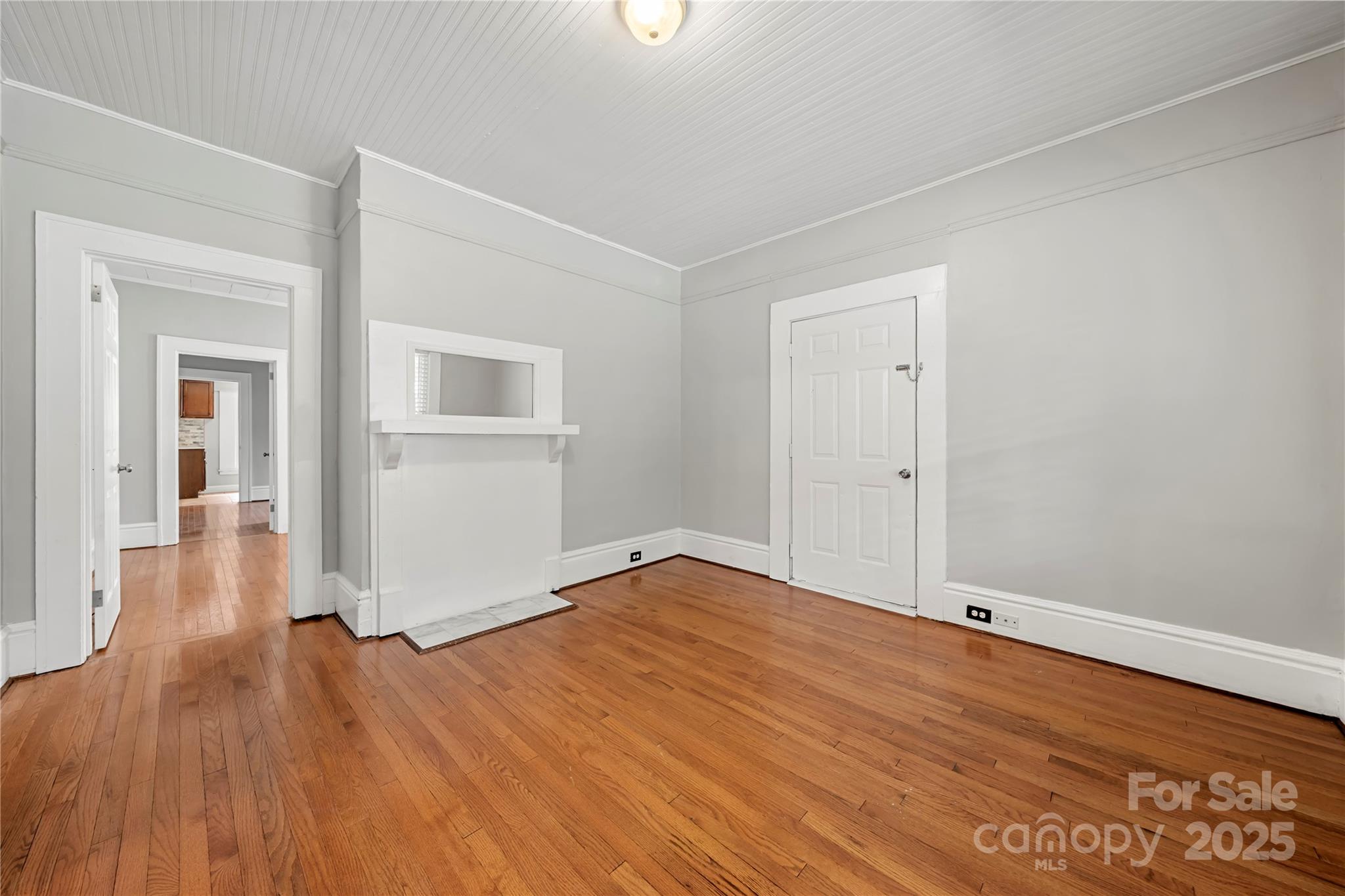 215 West D Street Newton, NC 28658 - Photo 15 of 48 wooden floor in an empty room with a window