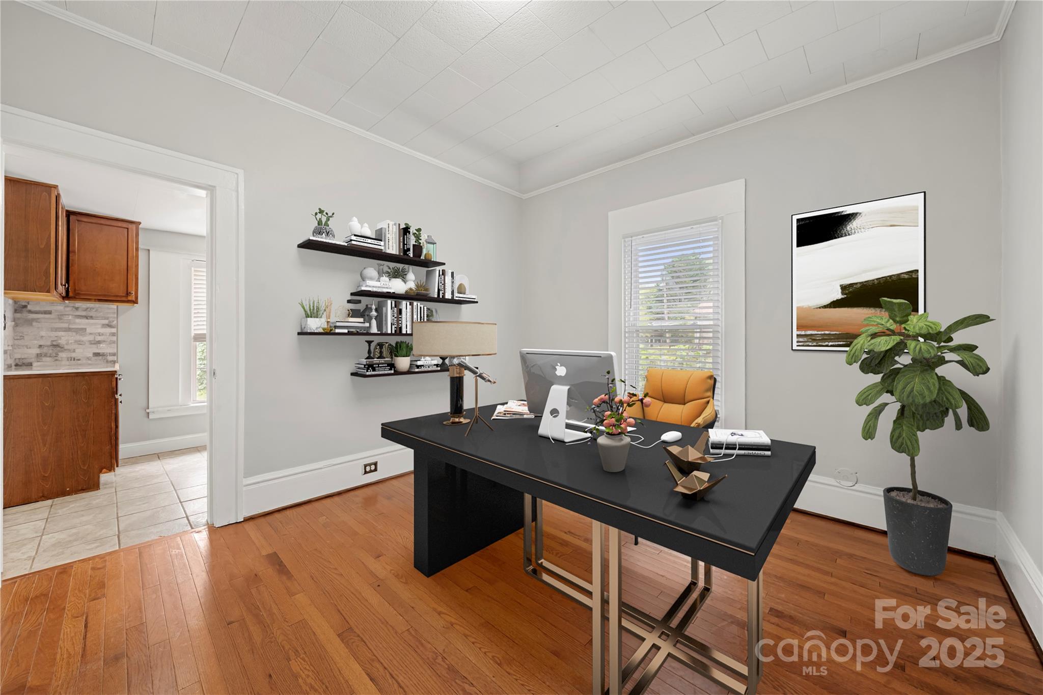 215 West D Street Newton, NC 28658 - Photo 18 of 48 a living room with furniture wooden floor and a potted plant