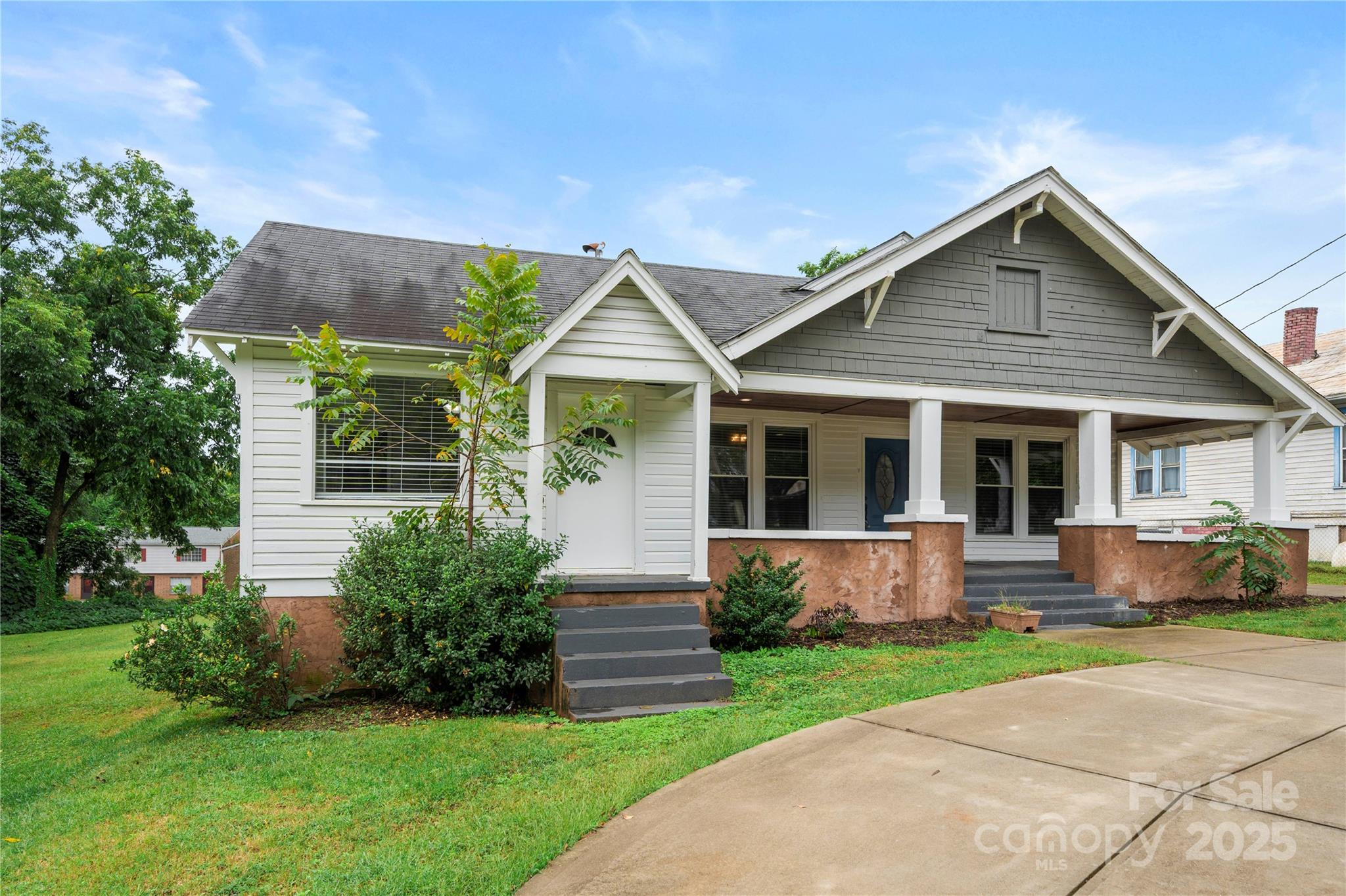 215 West D Street Newton, NC 28658 - Photo 2 of 48 a front view of house with yard and green space