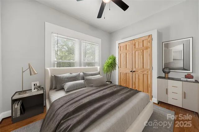 a bedroom with a large bed and a tv