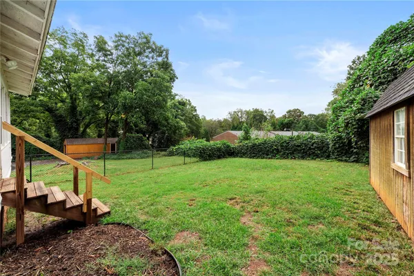 a view of a backyard with couches