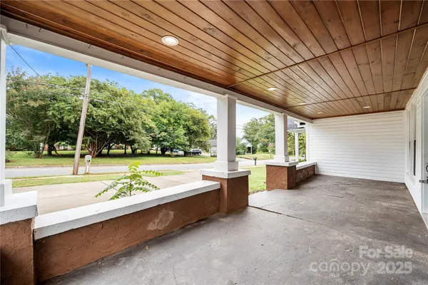 a swimming pool with outdoor seating and yard