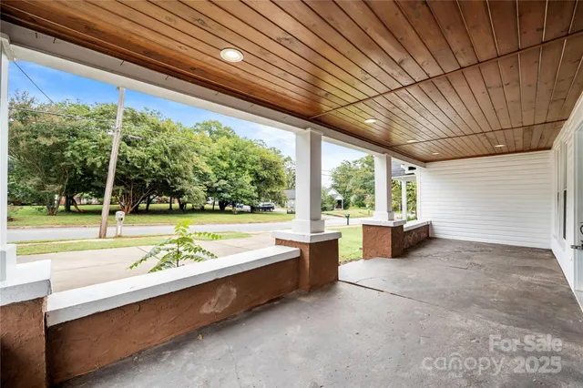 a swimming pool with outdoor seating and yard