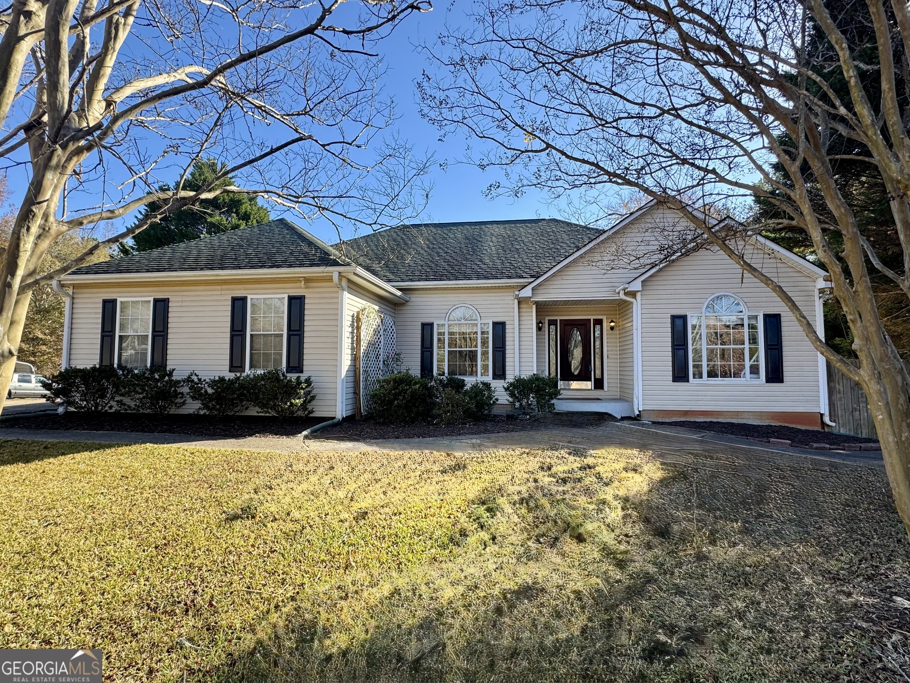 a front view of a house with a yard and porch