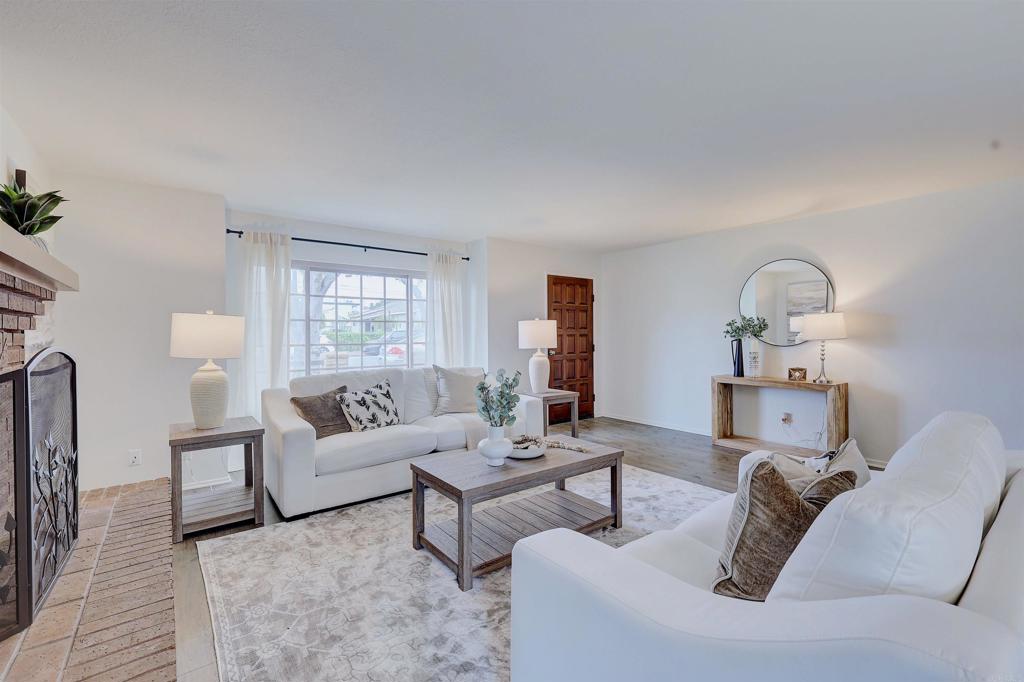 418 3rd Street Encinitas, CA 92024 - Photo 11 of 74 a living room with furniture and a fireplace