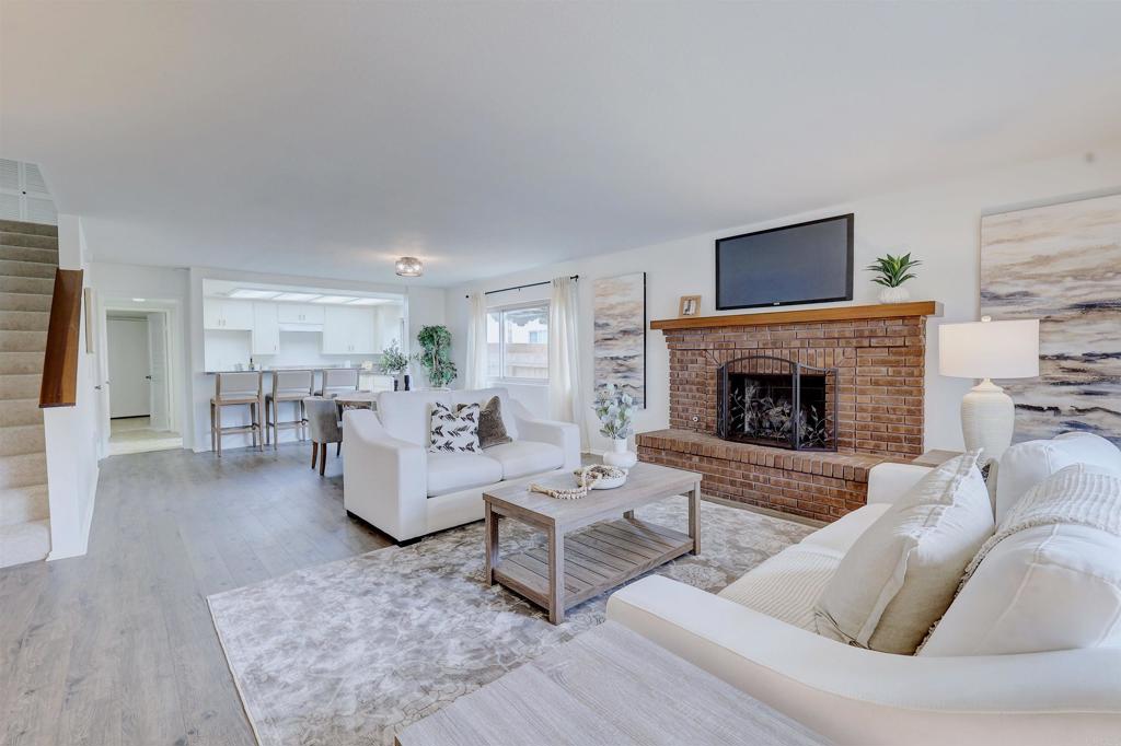 418 3rd Street Encinitas, CA 92024 - Photo 12 of 74 a living room with furniture and a fireplace