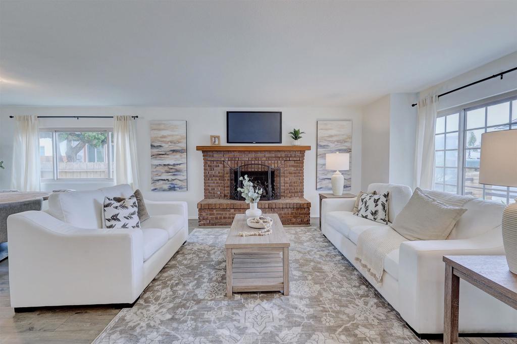 418 3rd Street Encinitas, CA 92024 - Photo 13 of 74 a living room with furniture and a fireplace