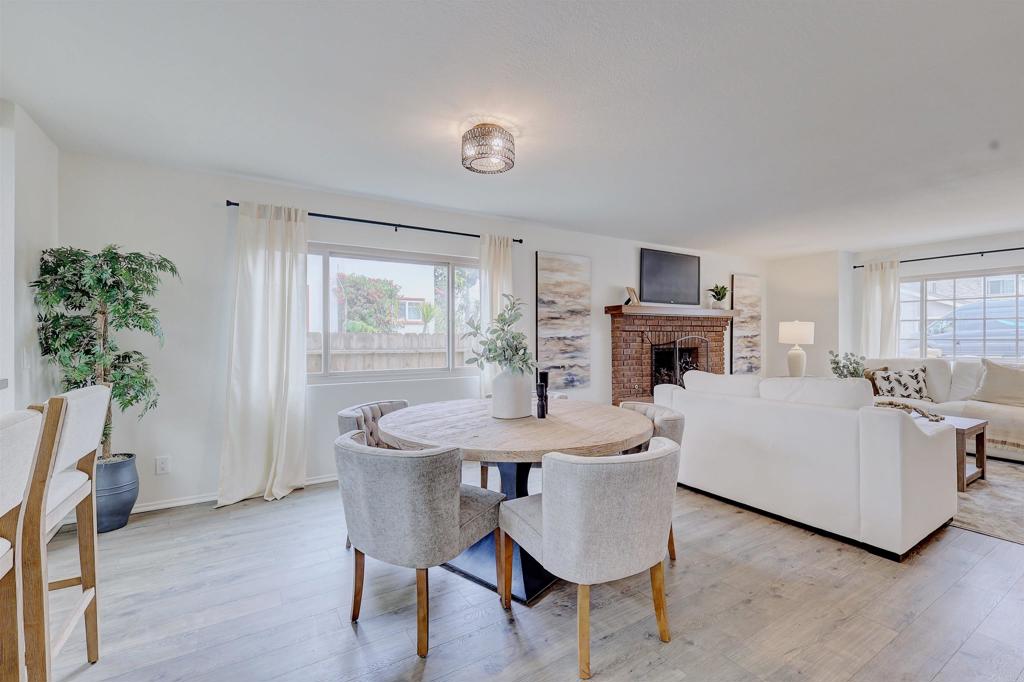 418 3rd Street Encinitas, CA 92024 - Photo 16 of 74 a living room with furniture a fireplace and a potted plant