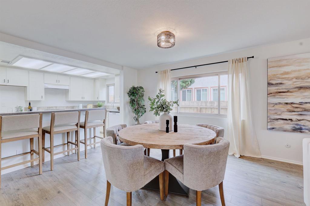 418 3rd Street Encinitas, CA 92024 - Photo 18 of 74 a dining room with furniture and wooden floor