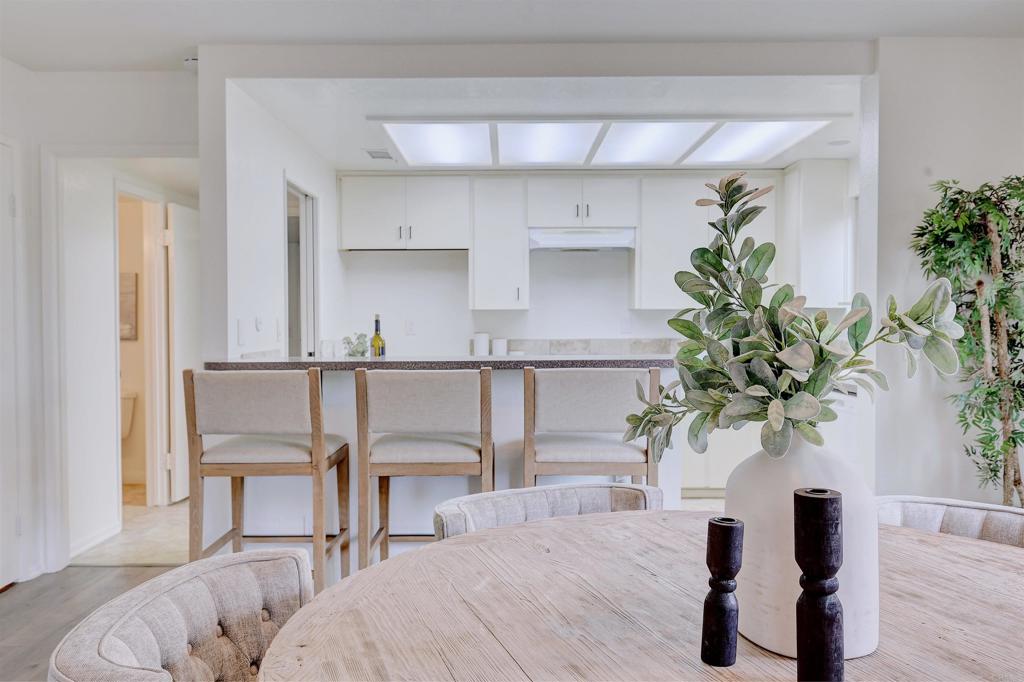418 3rd Street Encinitas, CA 92024 - Photo 19 of 74 a living room with furniture potted plant and a window