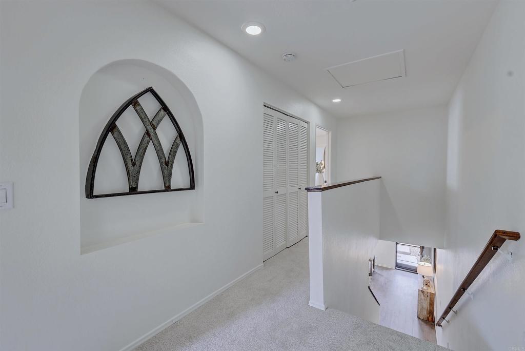 418 3rd Street Encinitas, CA 92024 - Photo 27 of 74 a view of staircase with wooden floor and white walls
