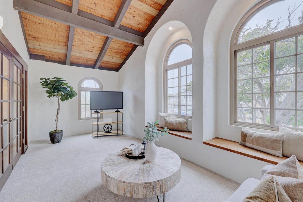 418 3rd Street Encinitas, CA 92024 - Photo 30 of 74 a living room with furniture and a flat screen tv