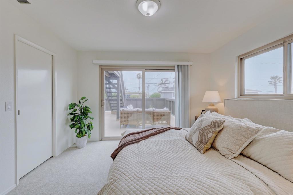 418 3rd Street Encinitas, CA 92024 - Photo 42 of 74 a bedroom with a bed and a potted plant
