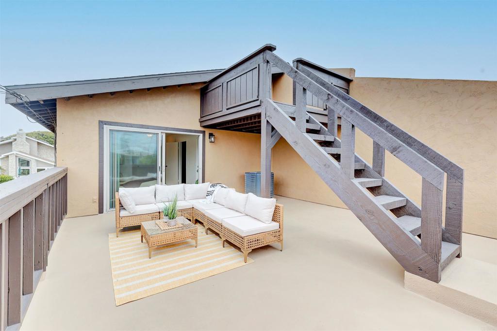 418 3rd Street Encinitas, CA 92024 - Photo 48 of 74 a living room with furniture and a staircase