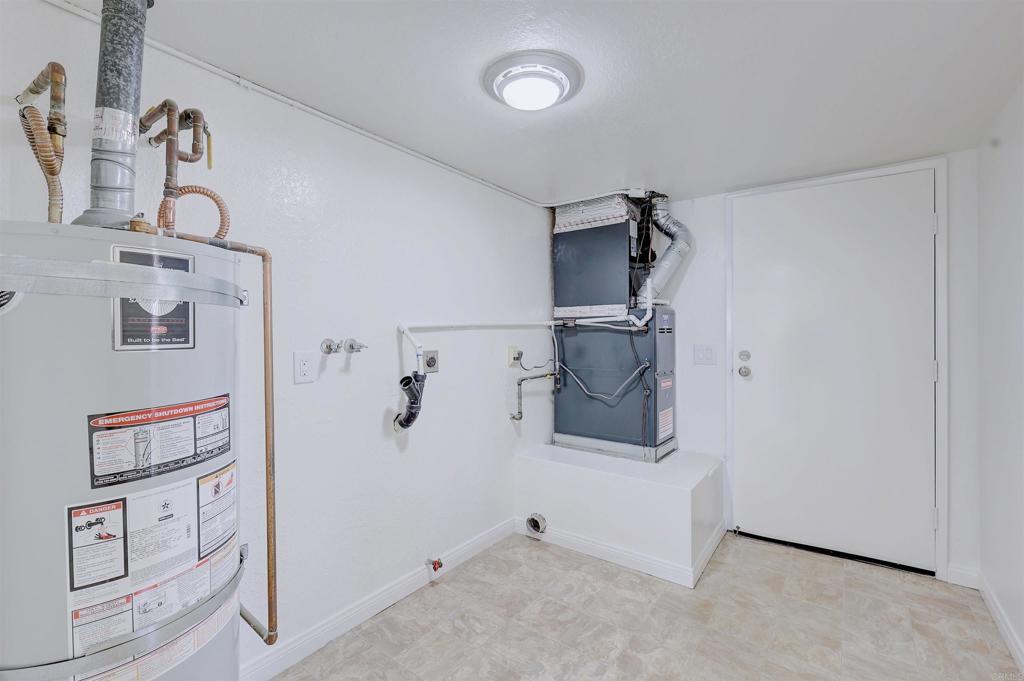 418 3rd Street Encinitas, CA 92024 - Photo 54 of 74 a view of storage and utility room with racks on the wall