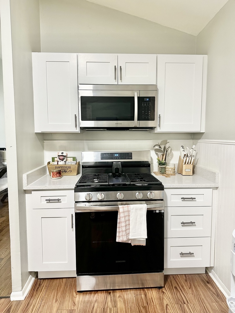 3420 Roesner Drive Markham, IL 60428 - Photo 5 of 21 a kitchen with stainless steel appliances granite countertop a stove and a microwave