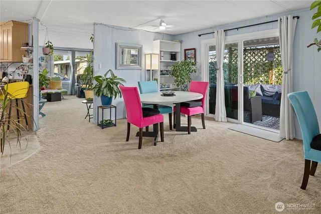 a view of a livingroom with furniture and a window