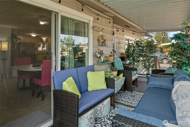 a outdoor living space with furniture and a potted plant