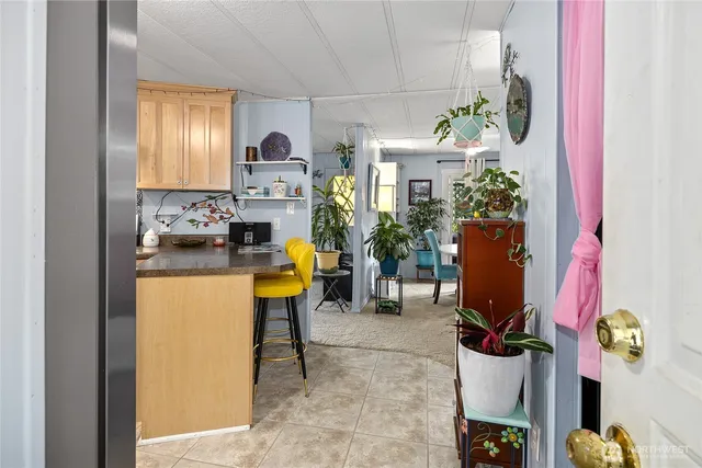 a view of living room filled with furniture and furniture