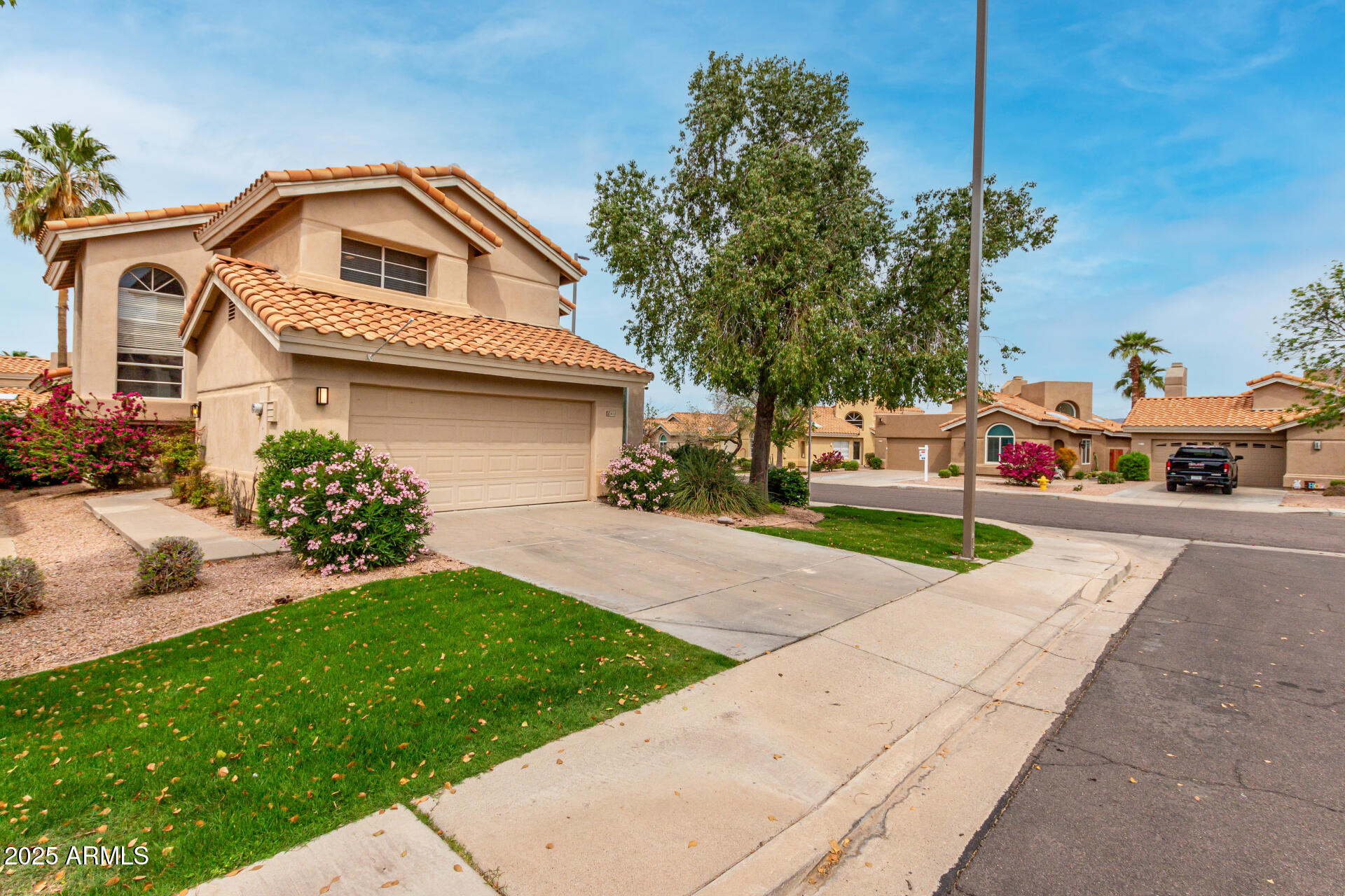 3832 North Gallatin Mesa, AZ 85215 - Photo 11 of 41 a front view of a house with a yard