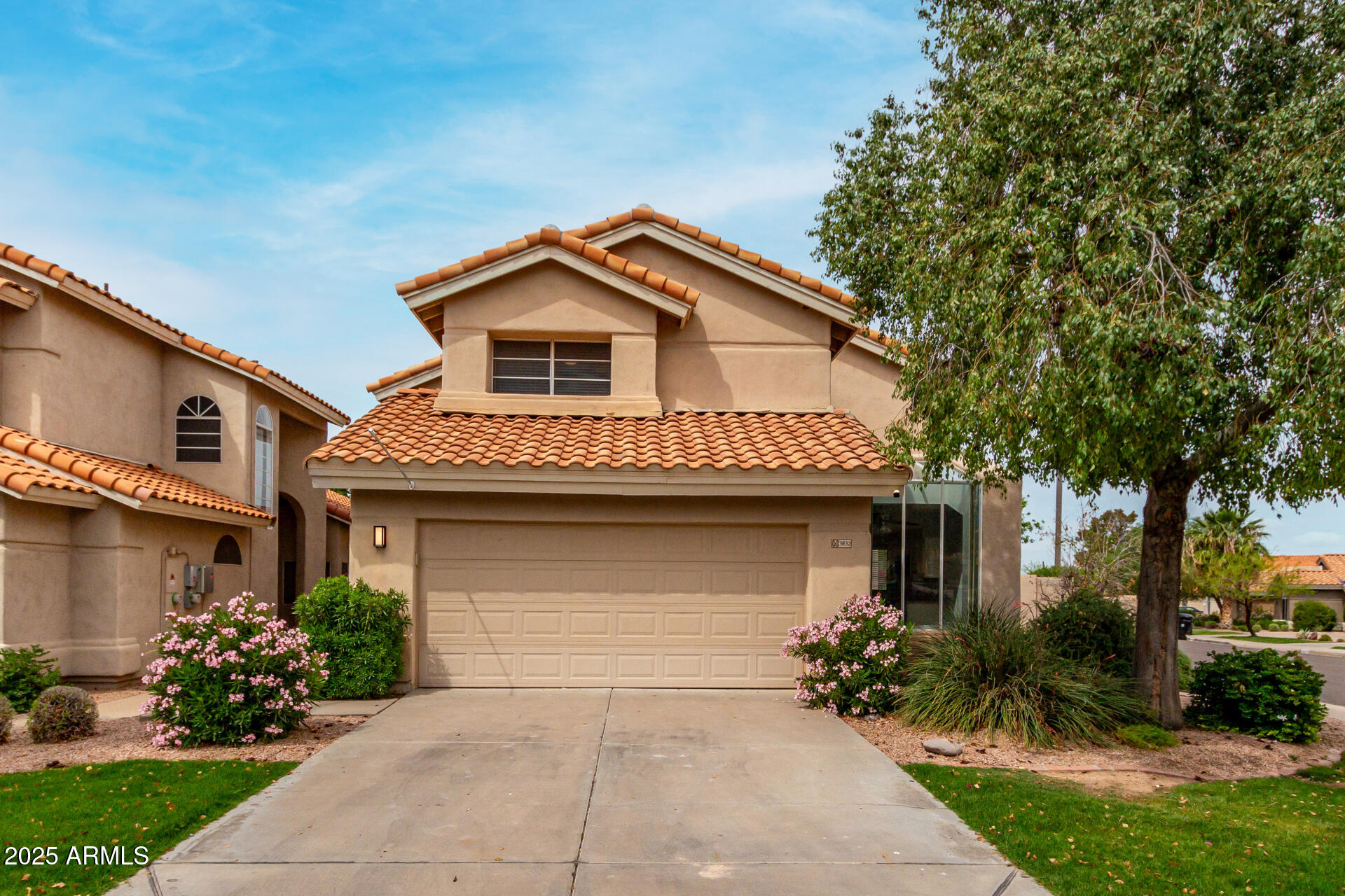 3832 North Gallatin Mesa, AZ 85215 - Photo 13 of 41 a front view of a house with a garden