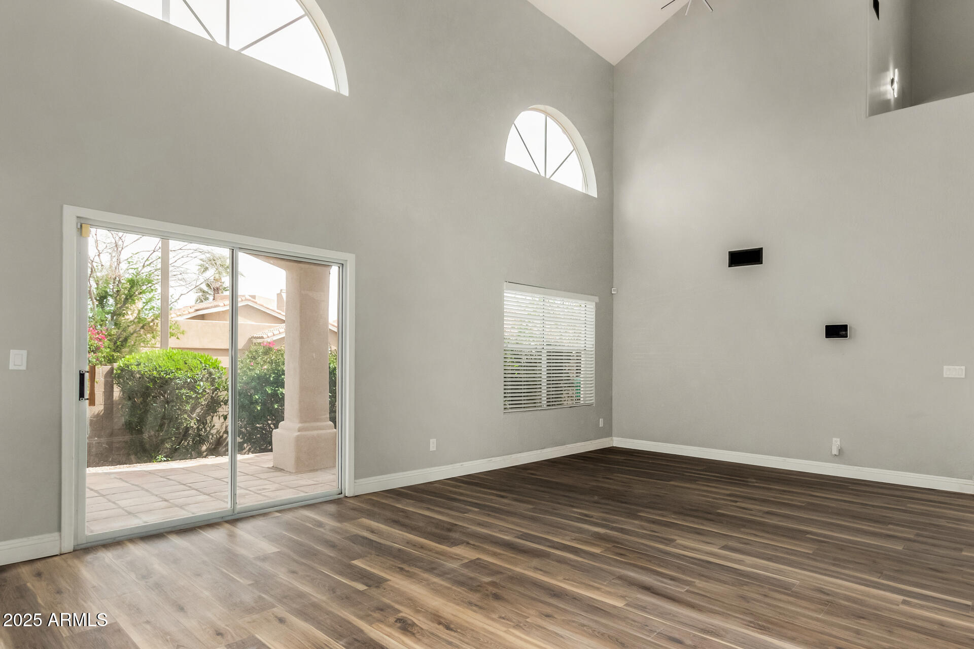 3832 North Gallatin Mesa, AZ 85215 - Photo 17 of 41 a view of empty room with wooden floor and fan