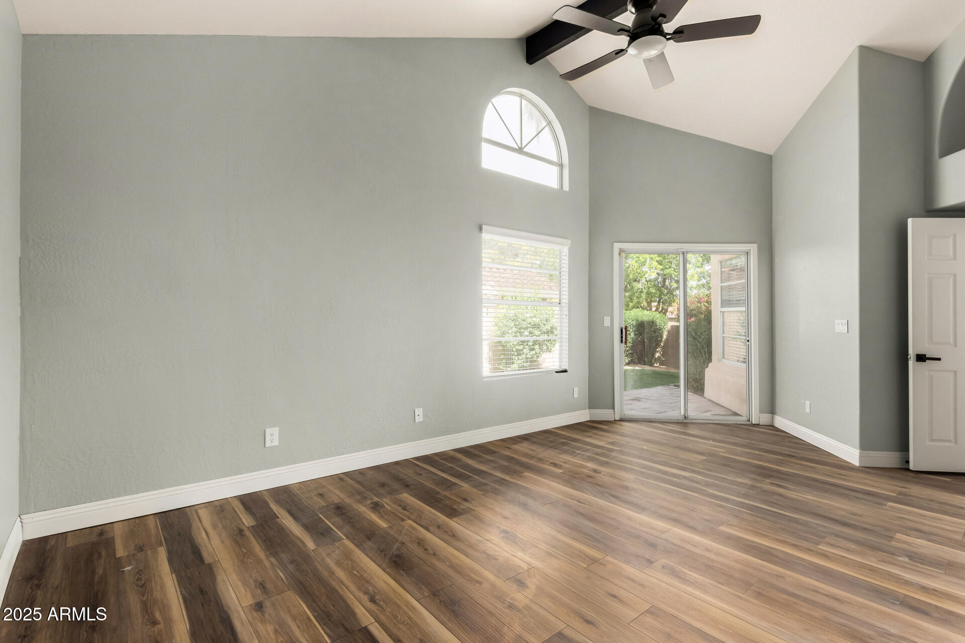 3832 North Gallatin Mesa, AZ 85215 - Photo 23 of 41 a view of an empty room with a window and wooden floor