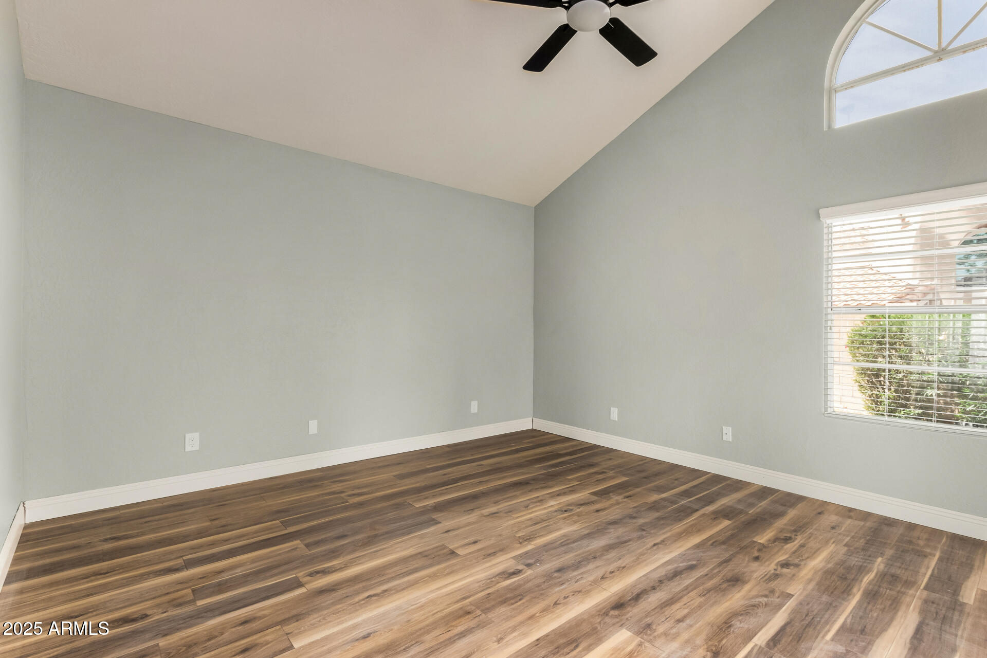 3832 North Gallatin Mesa, AZ 85215 - Photo 24 of 41 wooden floor in an empty room with a window