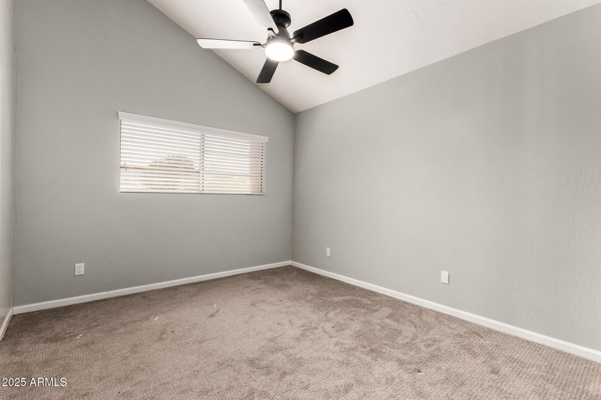 3832 North Gallatin Mesa, AZ 85215 - Photo 31 of 41 an empty room with a window and a fan