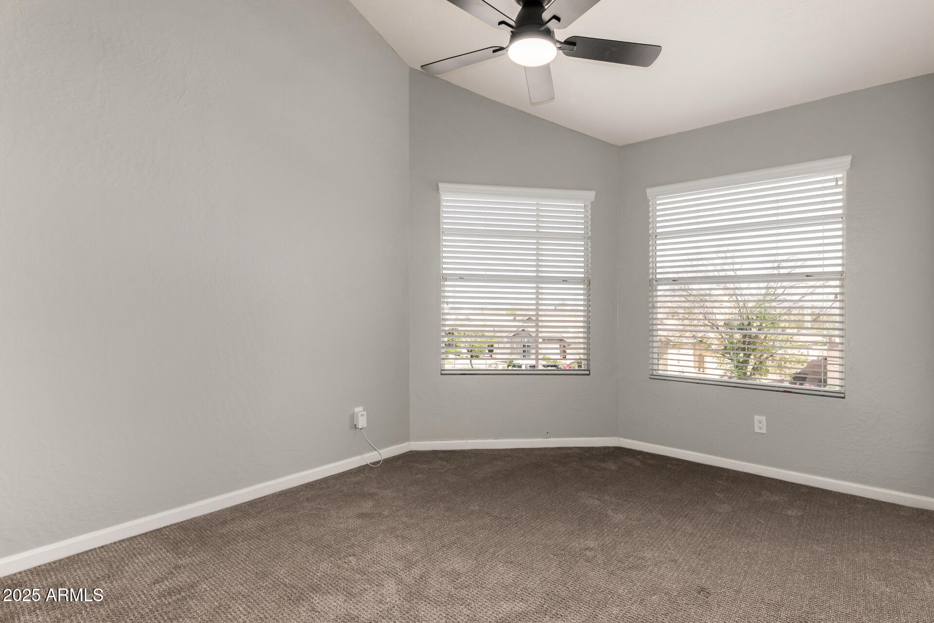 3832 North Gallatin Mesa, AZ 85215 - Photo 33 of 41 an empty room with a window and a fan
