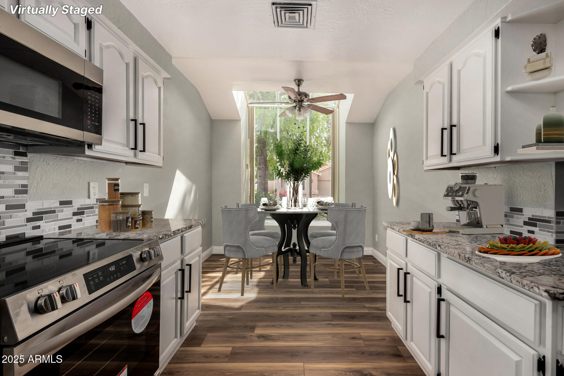 3832 North Gallatin Mesa, AZ 85215 - Photo 6 of 41 a kitchen with a stove and a white cabinets