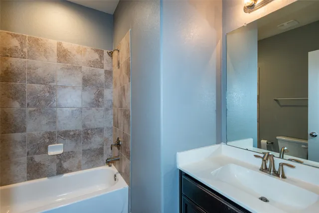 a bathroom with a sink and a bathtub
