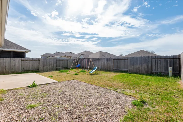 a swimming pool with wooden fence