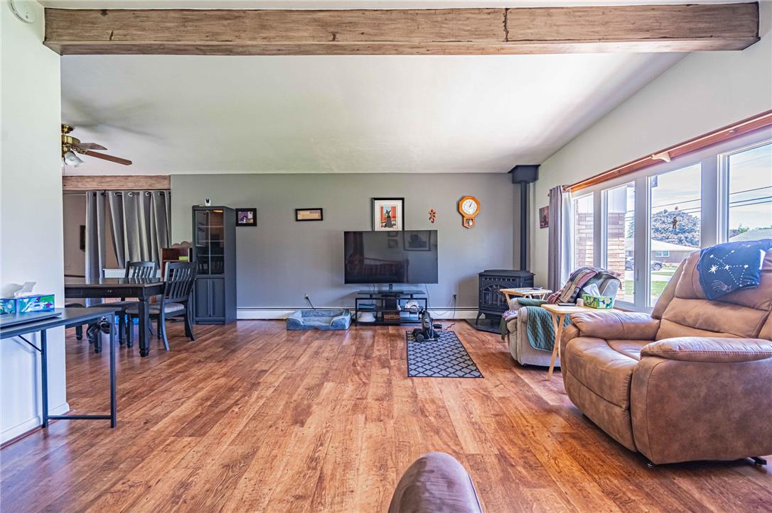 579 Cherry Road Northampton, PA 18067 - Photo 11 of 57 Warm laminate flooring (over real hardwood floors) extends throughout this inviting living and dining area, accented by a prominent exposed beam.
