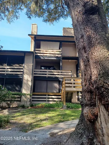 a view of a kitchen with a stove and a microwave oven