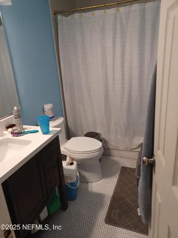 a bathroom with a sink and a toilet