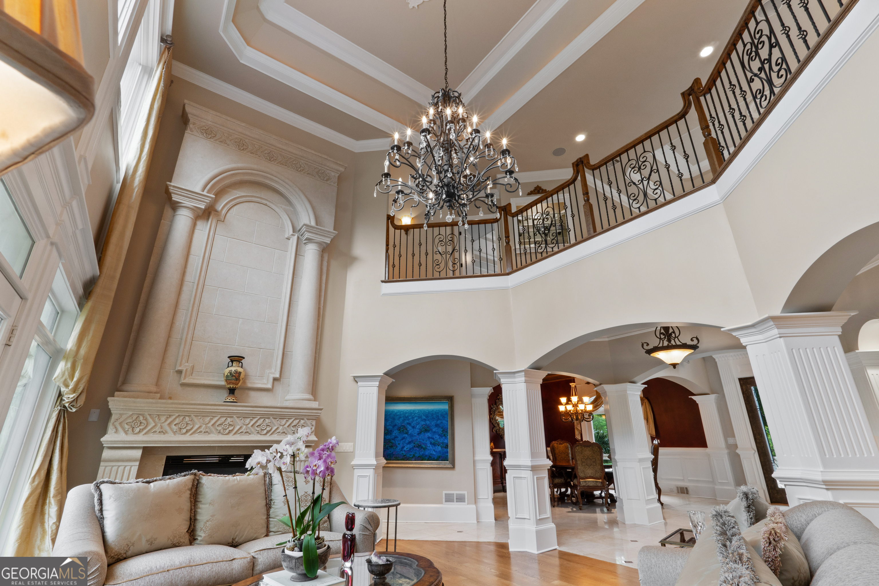 1005 Oak Mountain Road Carrollton, GA 30116 - Photo 15 of 73 a living room with fireplace furniture and a chandelier