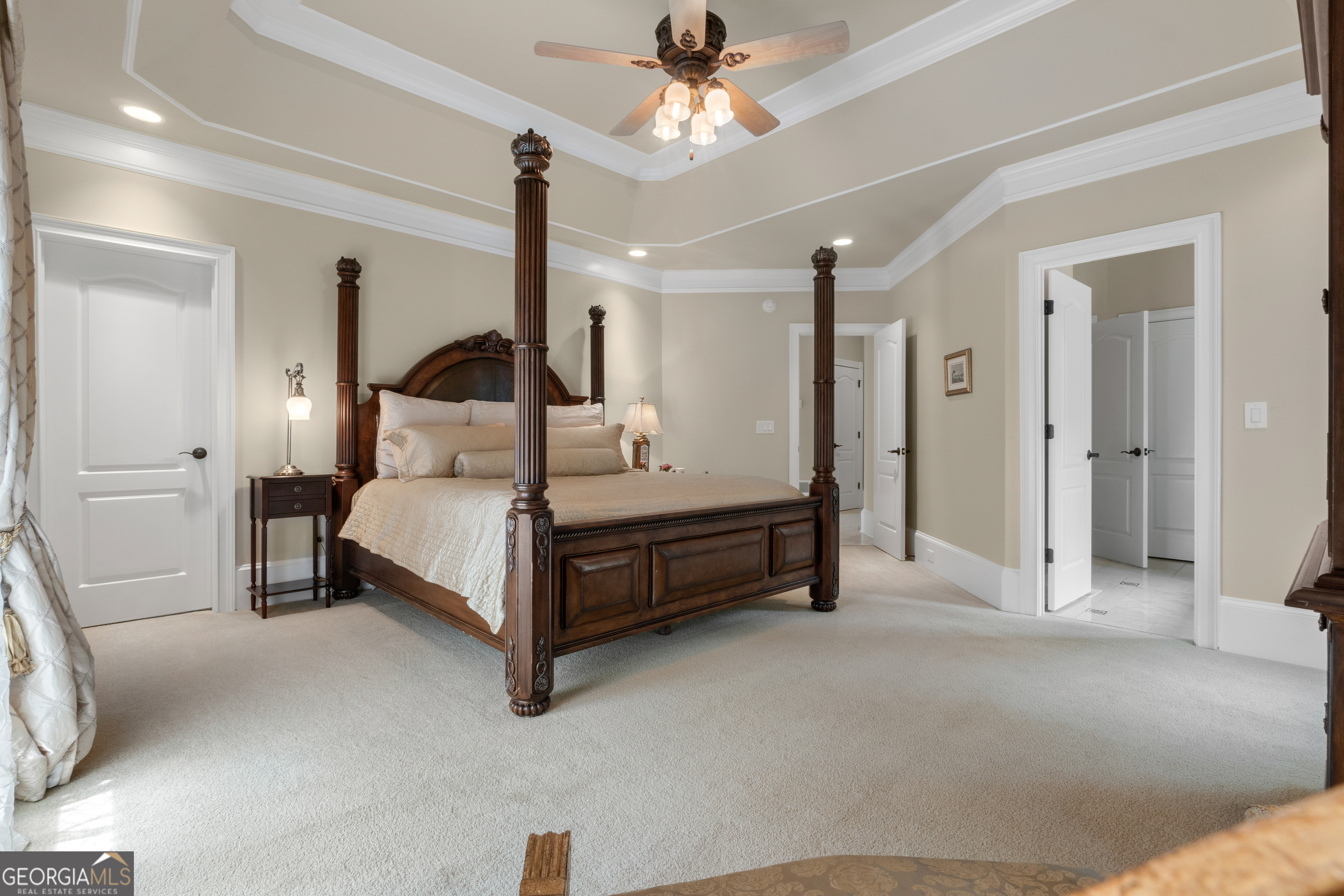 1005 Oak Mountain Road Carrollton, GA 30116 - Photo 29 of 73 a bed room with a bed and a chandelier