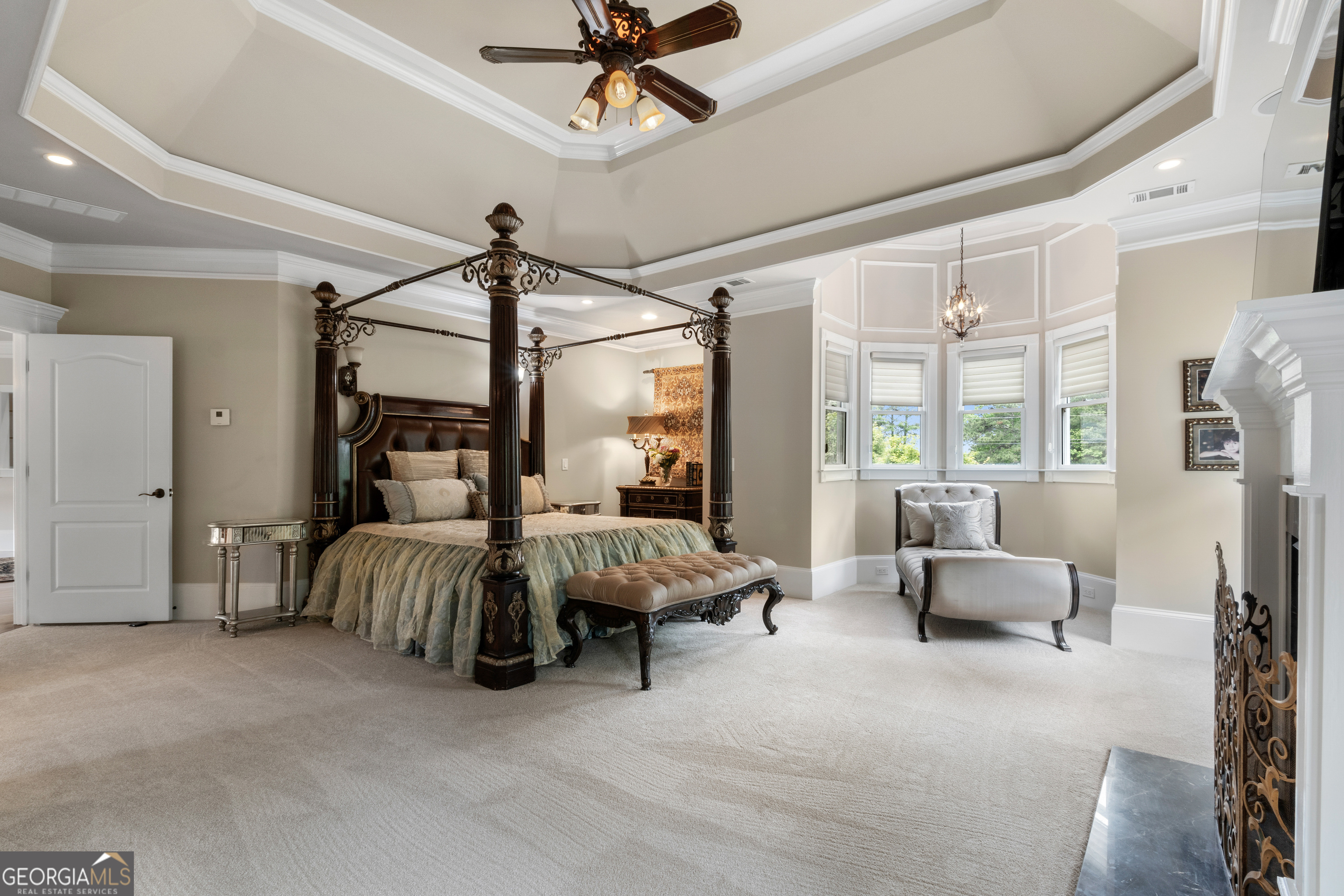 1005 Oak Mountain Road Carrollton, GA 30116 - Photo 36 of 73 a bedroom with furniture and a chandelier