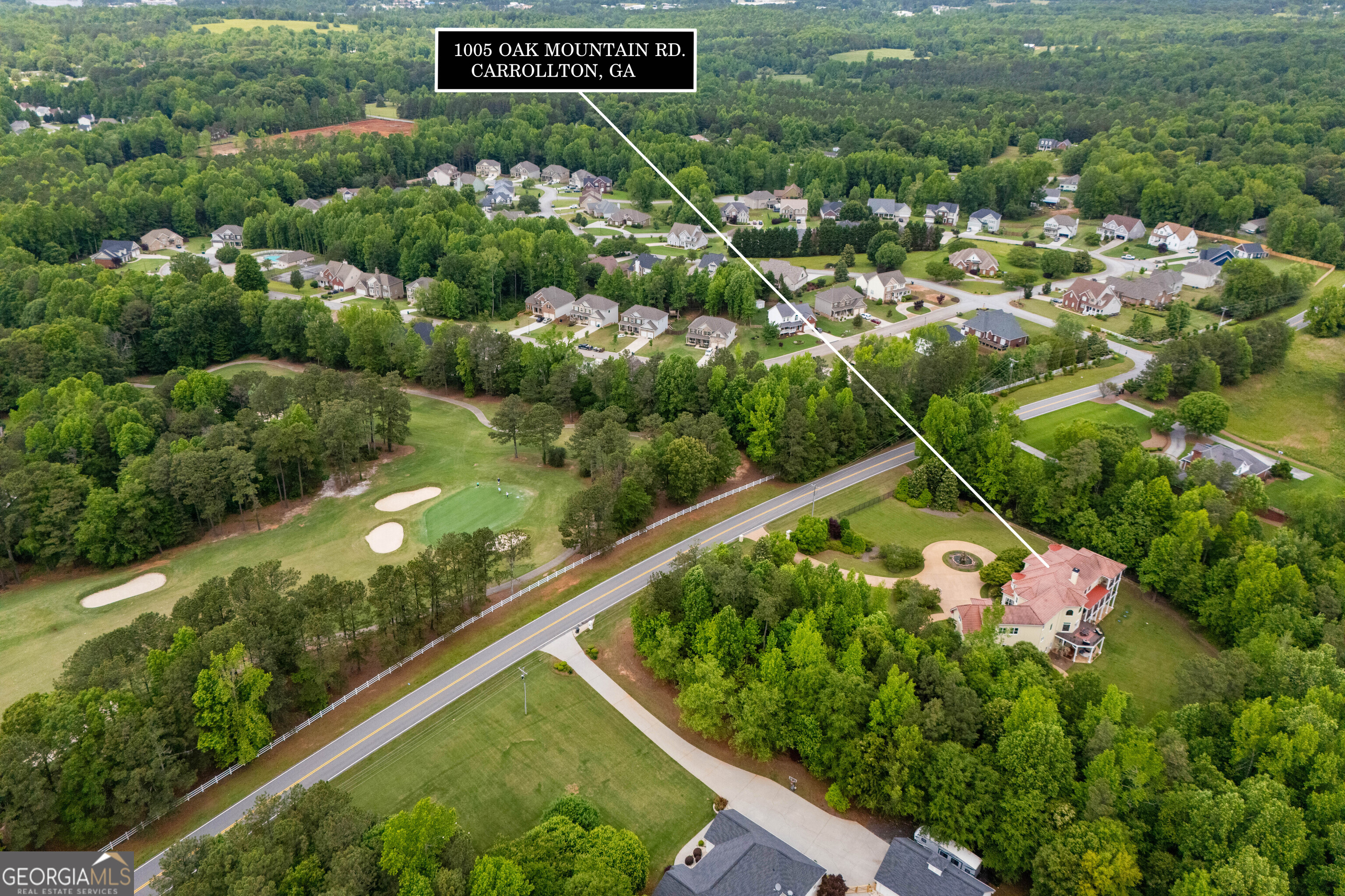 1005 Oak Mountain Road Carrollton, GA 30116 - Photo 72 of 73 a view of a garden with a street