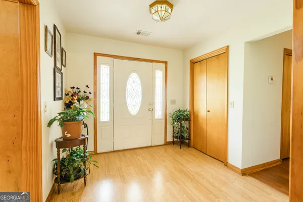a dining room with furniture and window
