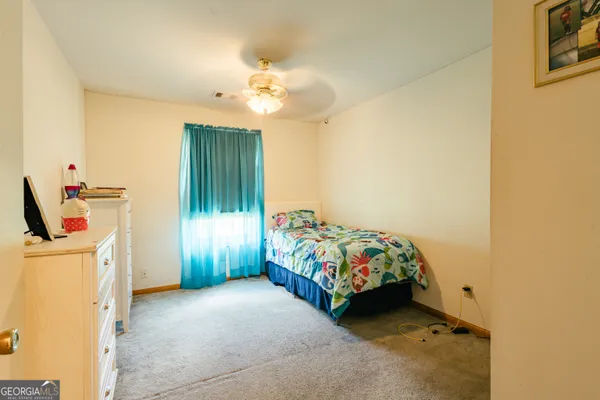 a bedroom with a bed and a cabinets