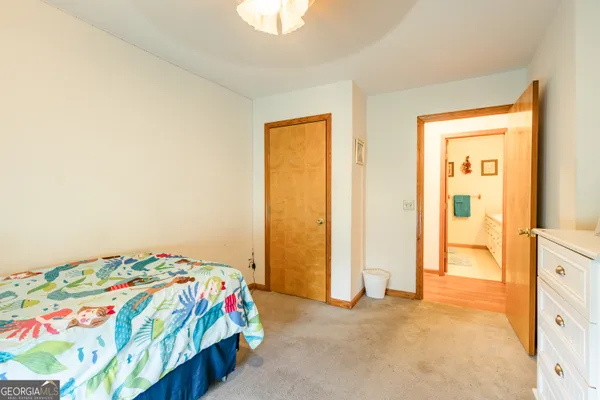 a bathroom with a sink vanity mirror and a shower