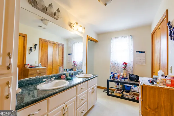 a white toilet sitting next to a shower curtain