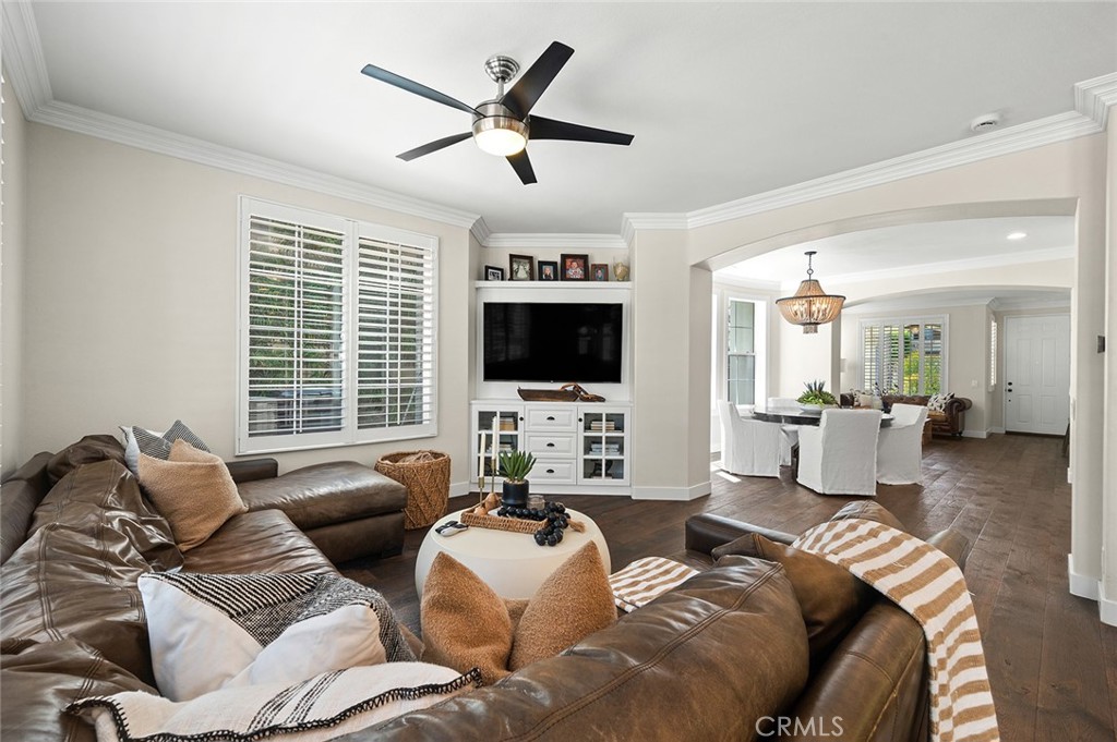 9 Baudin Circle Ladera Ranch, CA 92694 - Photo 11 of 48 a living room with furniture ceiling fan and a flat screen tv