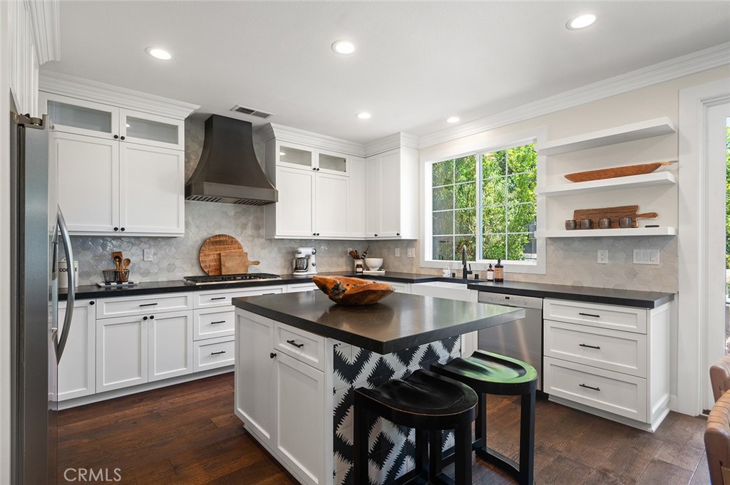 9 Baudin Circle Ladera Ranch, CA 92694 - Photo 14 of 48 a kitchen with a sink a stove a refrigerator and a cabinets