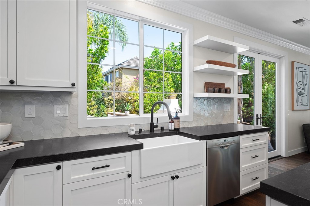9 Baudin Circle Ladera Ranch, CA 92694 - Photo 17 of 48 a kitchen with a sink and large window