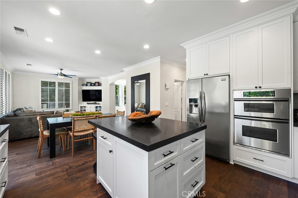 9 Baudin Circle Ladera Ranch, CA 92694 - Photo 18 of 48 a kitchen view with stainless steel appliances granite countertop a stove and a refrigerator